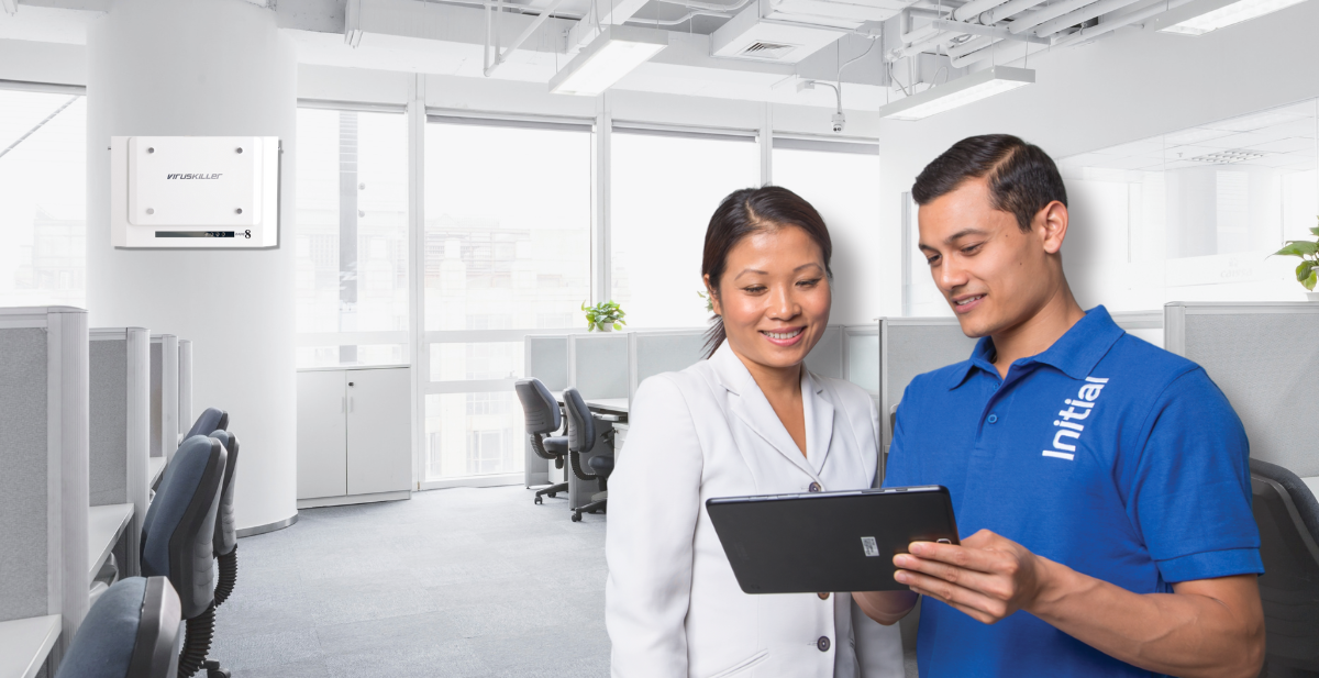 Certified technician providing professional consulting regarding Initial VIRUSKILLER™ commercial air purifier unit.