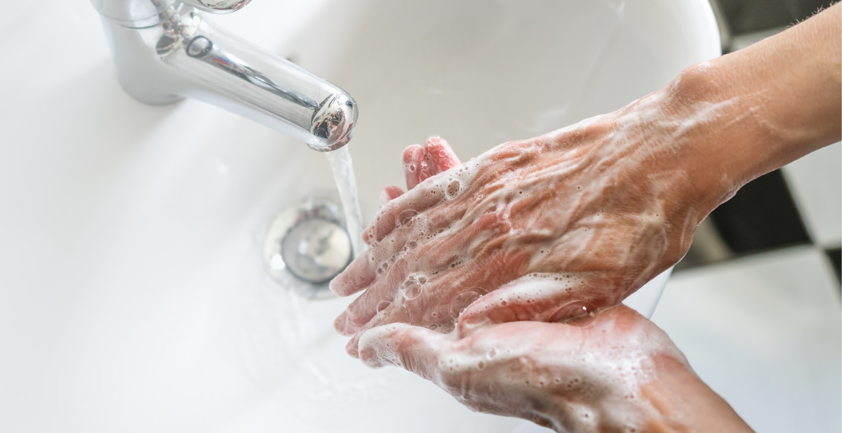 An array of Initial Singapore's hand hygiene products, including hand soap, paper towel, sanitizer, and dispensers.
