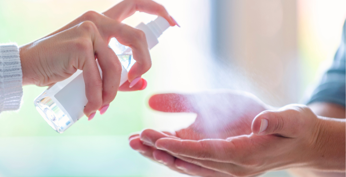 Bulk refill bottle of Initial Hygiene Liquid Hand Sanitiser and an Alcohol-Free sanitiser bottle for commercial washroom dispensers.