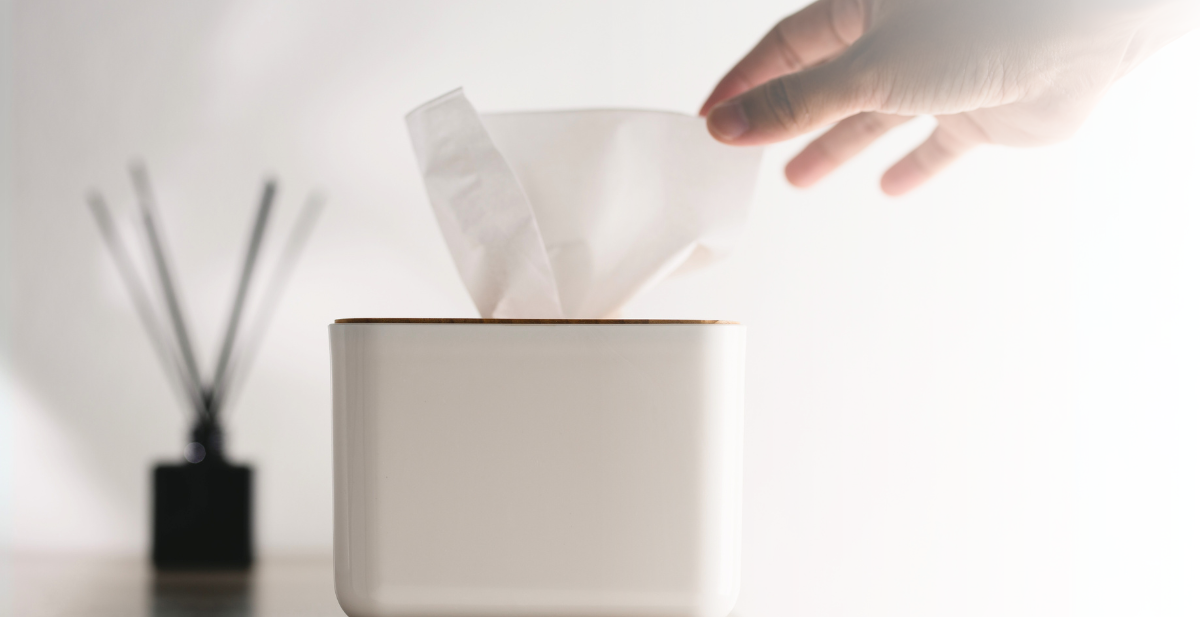 Bulk case of Initial Hygiene 2-ply tissue boxes stacked for commercial office supply.