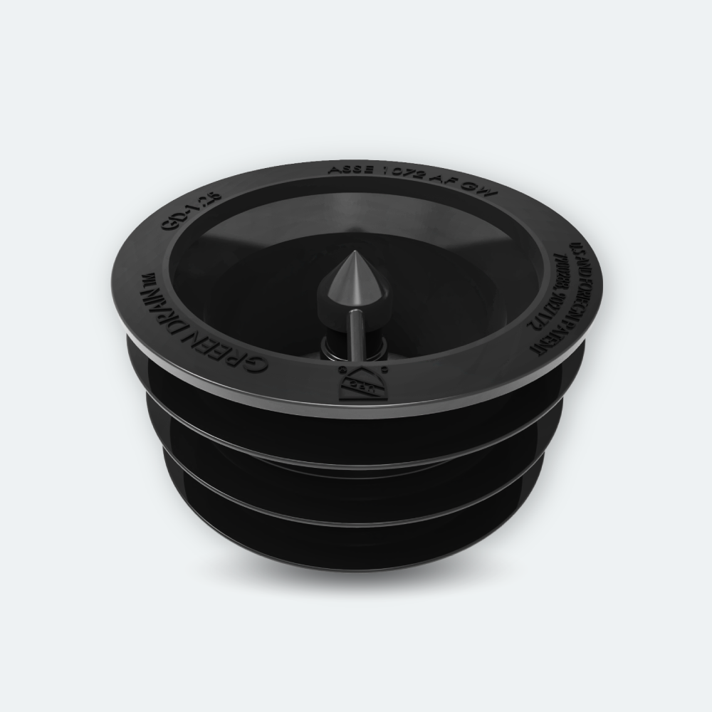 Initial Hygiene Singapore Green Drain 1.25 inch floor trap with black silicone skirt for blocking sewer smells and pests. 